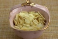 Pink deep vintage saucer with thinly sliced Ã¢â¬â¹Ã¢â¬â¹almonds. Healthy food ingredients